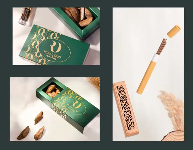Green oud boxes, oud chips and an incense stick on a cream backdrop
